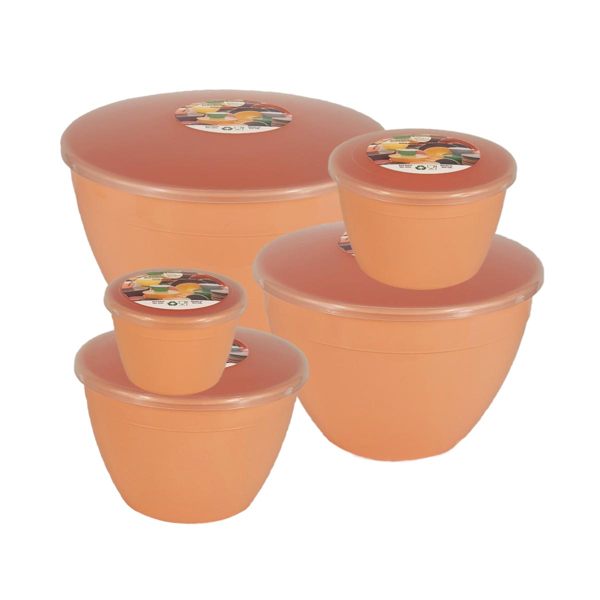 Set of peach coloured plastic basins with lids on a white background