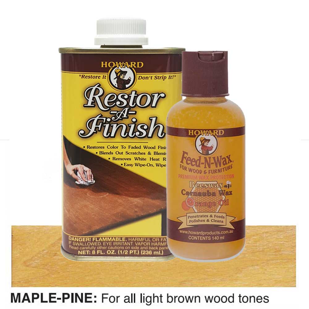 bottles of Howard Restor-A-Finish and Feed-N-Wax on a maple wooden surface.
