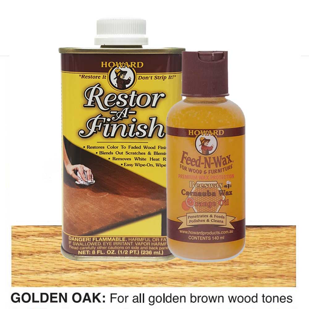 Howard Restor-A-Finish and Feed-N-Wax bottles on a golden oak wooden surface.
