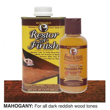 bottles of Howard Restor-A-Finish and Feed-N-Wax on a mahogany wooden surface.