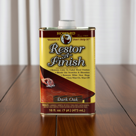 A can of restor a finish sat on a wooden surface that has been restored