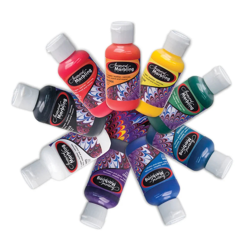 Assorted bottles of Jacquard Marbling paint on a white background