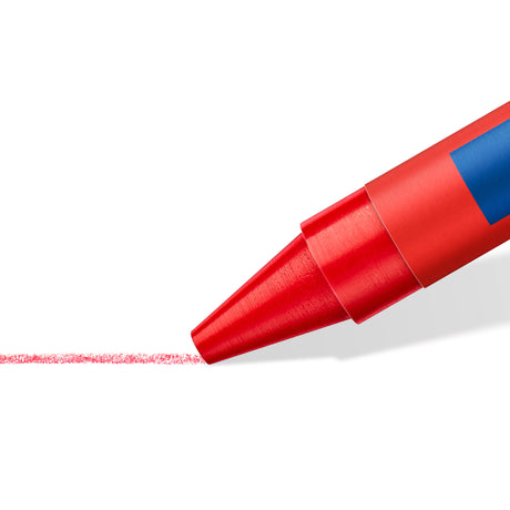 A close-up of a red crayon or marker tip drawing a fine red line on a white background, with a blue label visible on the side.