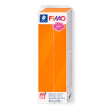 A 454 g (1 lb) block of Fimo Soft Tangerine Orange modelling clay in its original packaging against a plain white background.