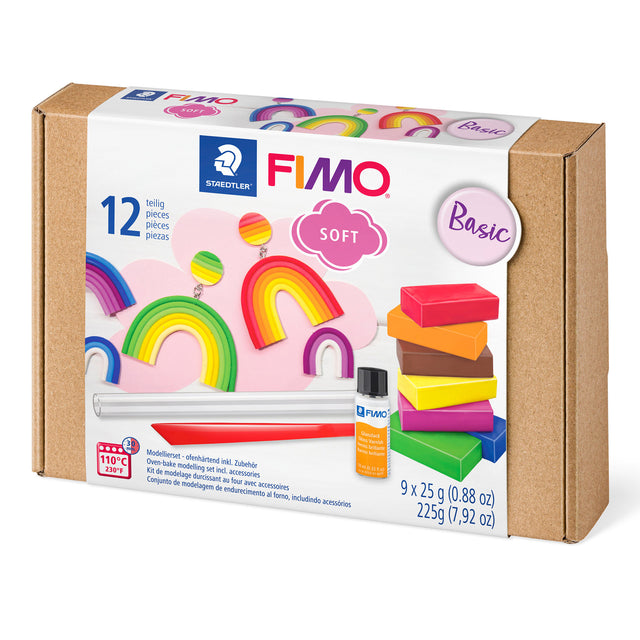 FIMO Soft Basic clay kit in a brown kraft paper box with a white front label showing rainbow and stacked clay pieces, plus a small bottle of adhesive and tools.