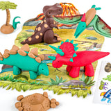 A set of colorful dinosaur clay figures and a prehistoric-themed play mat, arranged on a white background with a small palm tree, volcano, and sticker sheet nearby.