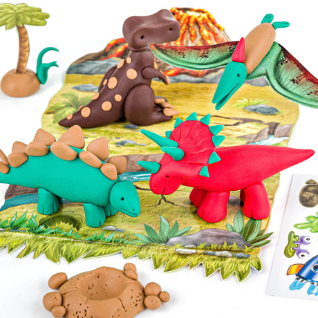 A set of colorful dinosaur clay figures and a prehistoric-themed play mat, arranged on a white background with a small palm tree, volcano, and sticker sheet nearby.