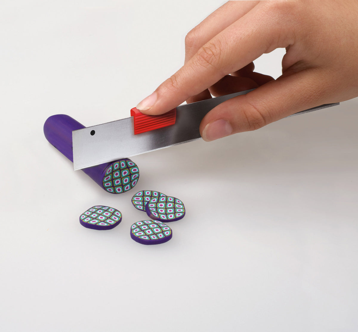 fimo polymer clay being cut into discs