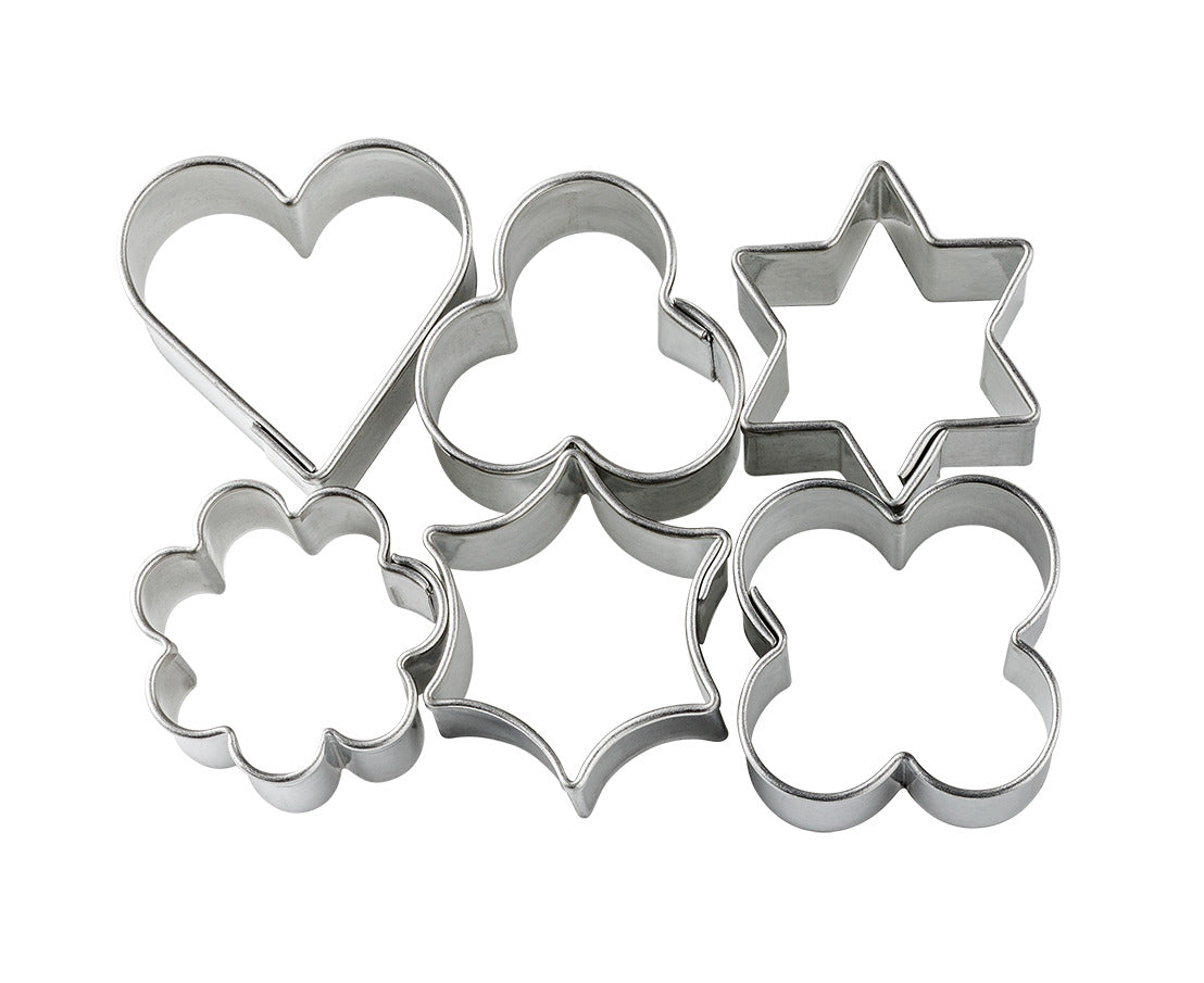 Set of metal cookie cutters in various shapes on a white background