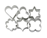 Set of metal cookie cutters in various shapes on a white background