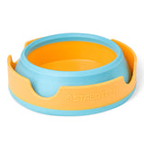 A Staedtler brand paint brush bowl with a light blue outer rim and a bright orange inner bowl and base, shown on a clean white background.