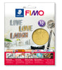 FIMO Stredtler 10-piece metallic leaf metal in gold, shown in its retail packaging with instructions and product examples.