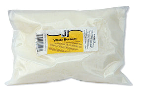Bag of white beeswax with a label on a white background