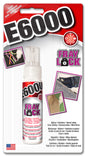 Packaging for E6000 Fray Lock Adhesive, showing the bottle of adhesive and examples of its use on fabric repairs and quilting.