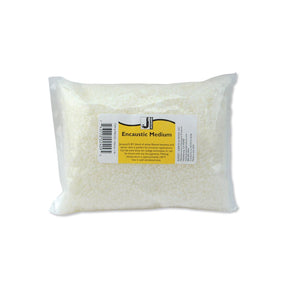 Pack of encaustic medium with a visible label on a white background