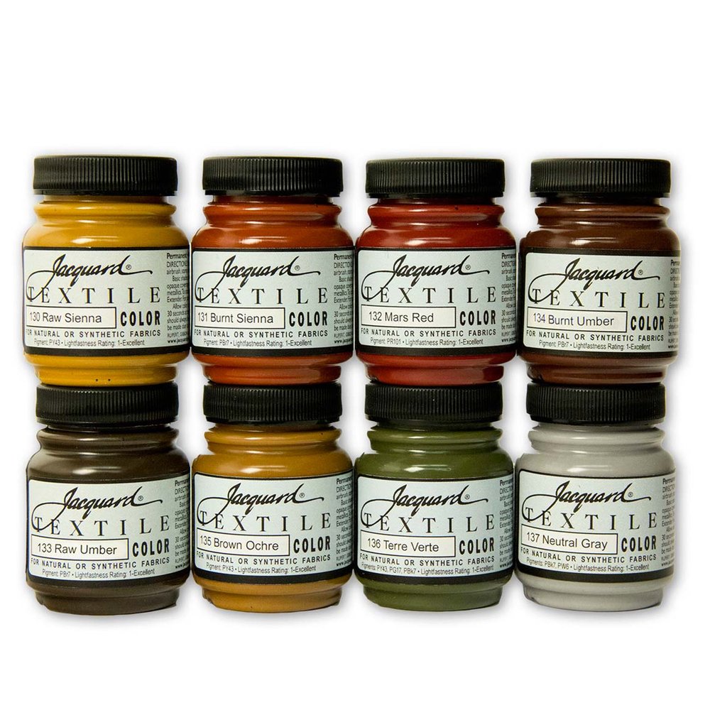 8 jars of Jacquard textile color fabric paints in earth tones on a white background
