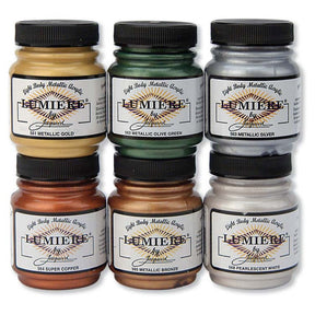 6 Jars of Jacquard Lumiere Metallic Fabric paints on a white background