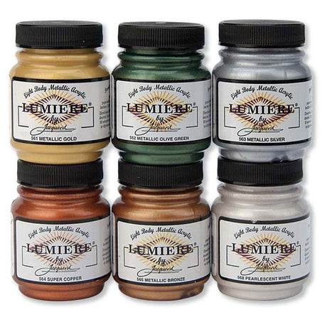 6 Jars of Jacquard Lumiere Metallic Fabric paints on a white background