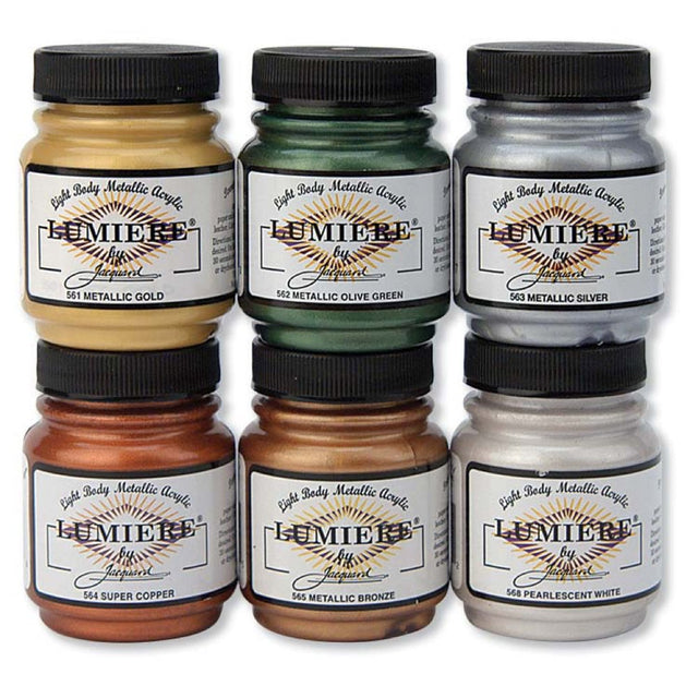 6 Jars of Jacquard Lumiere Metallic Fabric paints on a white background
