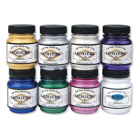 7 Jacquard Lumiere Jars with a jar of Neopaque extender on a white background