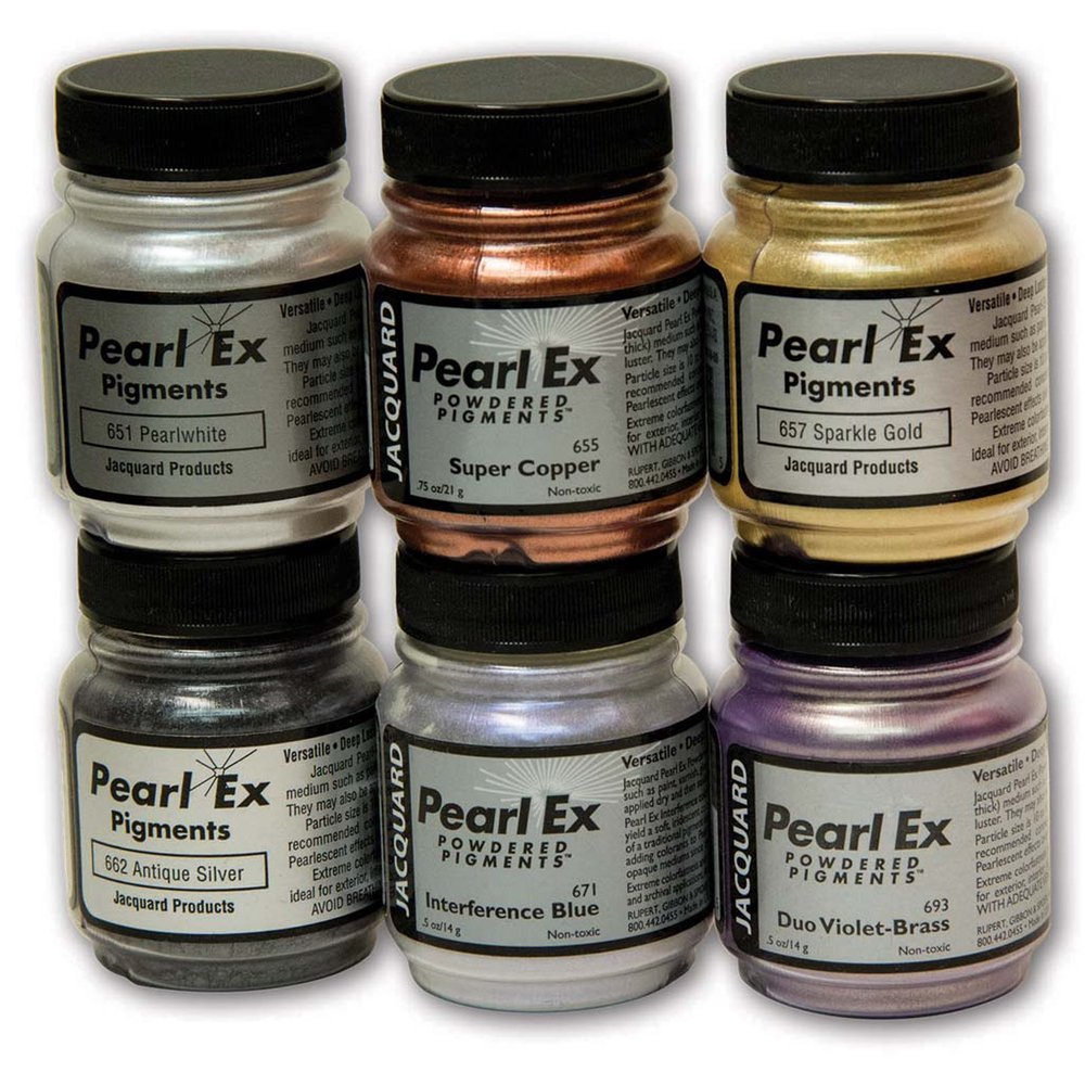 Six jars of Jacquard Pearl Ex Pigments powder arranged in two rows on a white background. The jars show different metallic and shimmer pigment colors: Pearlwhite, Super Copper, Sparkle Gold, Antique Silver, Interference Blue, and Duo Violet-Brass.