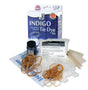 Indigo tie dye kit with packaging, dye, rubber bands, and other supplies on a white background