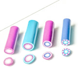 FIMO professional polymer clay millefiori tubes in different colours on a white background