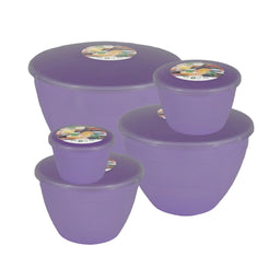 Set of lilac coloured plastic steamed pudding bowls with lids on a white background