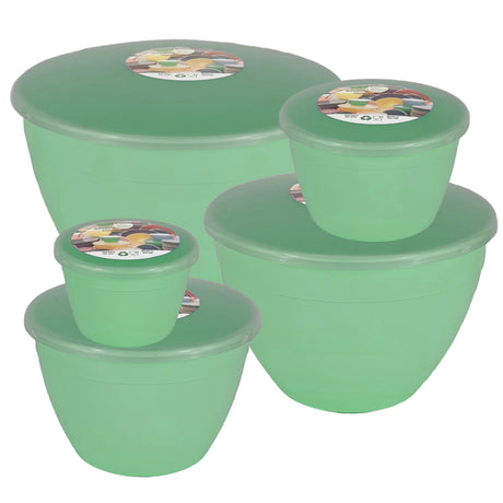 Set of green plastic pudding basins with lids on a white background