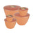 Set of peach coloured plastic basins with lids on a white background