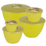 Set of yellow plastic containers with lids on a white background