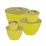 Set of yellow plastic steam pudding containers with lids on a white background