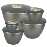 Set of silver coloured pudding basins with colorful labels on a white background