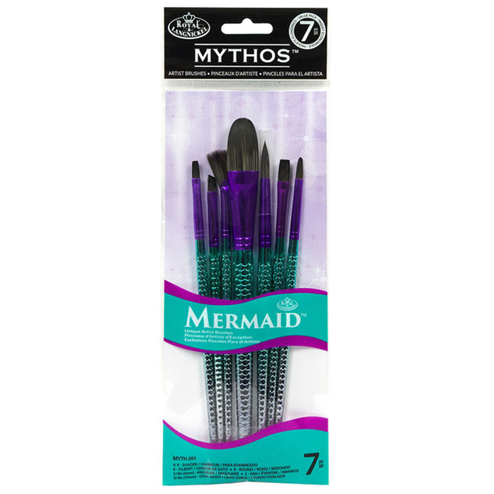 A set of Royal & Langnickel MYTHOS Mermaid inspired art brushes with blue and green mermaid scale patterned handles, packaged in a clear plastic case with a white and purple cardboard backing. Myth 201