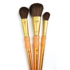 A set of three synthetic camel hair mop brushes with synthetic bristles and beige handles, lying flat on a white background.