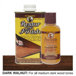 Howard Restor-A-Finish and Feed-N-Wax bottles on a dark walnut wooden surface with a white background.