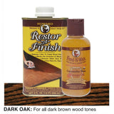 Two bottles of Howard Restor-A-Finish and Feed-N-Wax on a dark oak wooden surface.