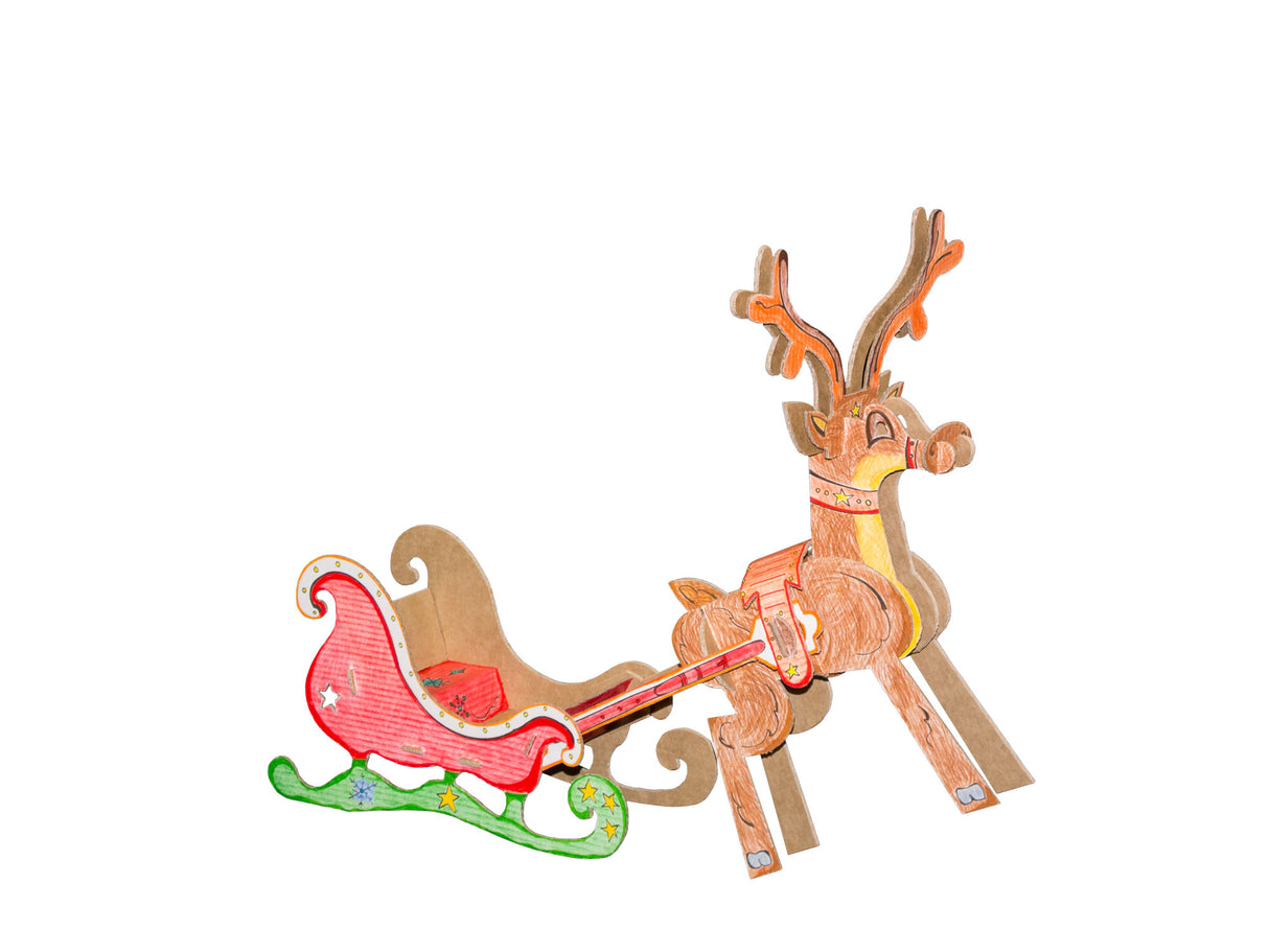 3d cardboard toy model of rudolf the reindeer pulling a sleigh that has been coloured in