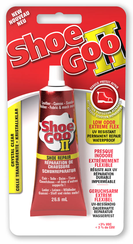 A tube of Shoe Goo II clear shoe glue with packaging displaying product information and usage instructions.