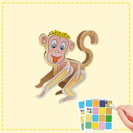 3d cardboard model of a monkey being coloured in by a child