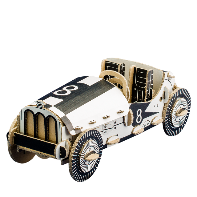 Model of a vintage race car with checkered pattern on a white background