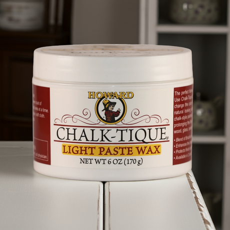 A tub of Howard Chalk-Tique paste wax sitting on a cabinet that has been painted shabby chic with chalk paint