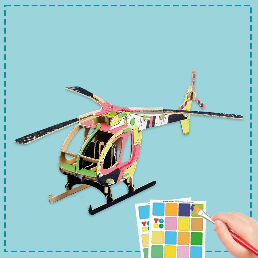 cardboard heicopter being painted by a kid