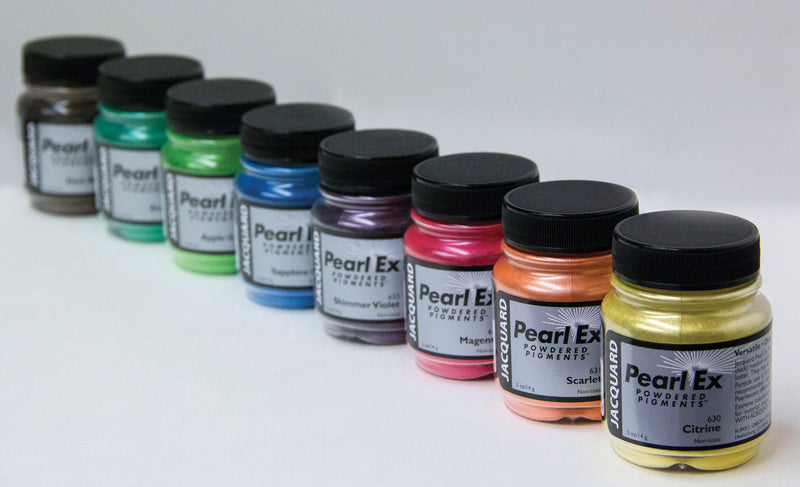 a row of pearl ex powdered pigment mica powder jars on a white surface