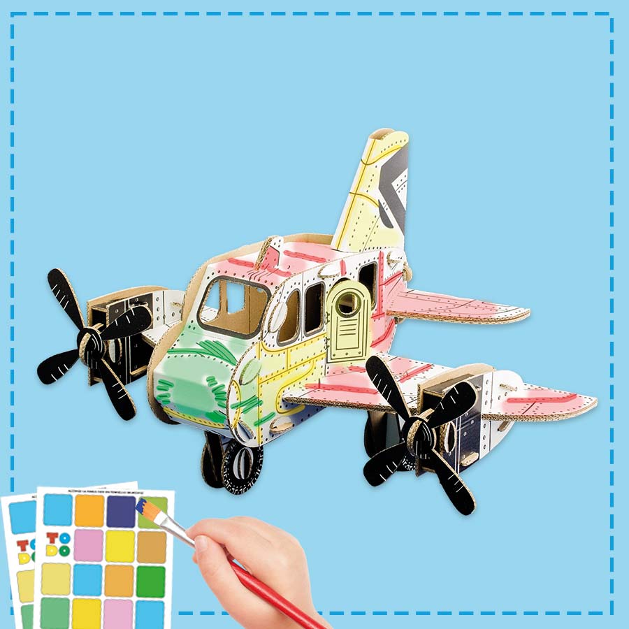 cardboard model of a plane being coloured in by a child