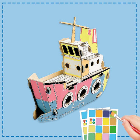 cardboard ship model being coloured in by a child