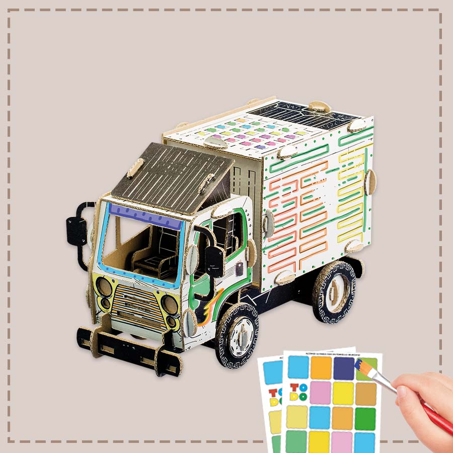 3d cardboard truck with a hand holding a paintbrush and color swatches on a neutral background