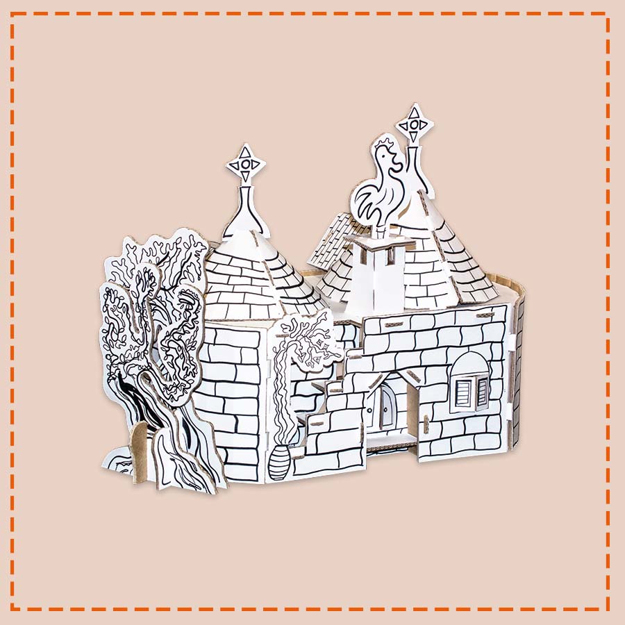 Cardboard cottage trullo model with trees on a beige background