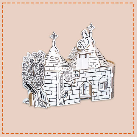 Cardboard cottage trullo model with trees on a beige background