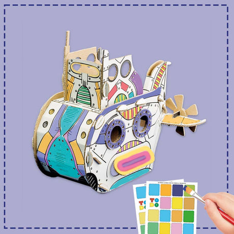 a cardboard submarine being painted by a child